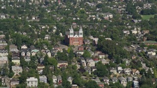 AX47_040E - 5K aerial stock footage approach Immaculate Conception Church in an urban residential area, Central Seattle, Washington