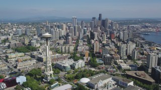 AX47_053 - 5K aerial stock footage fly over Seattle Center and by Space Needle to approach skyscrapers in Downtown Seattle, Washington