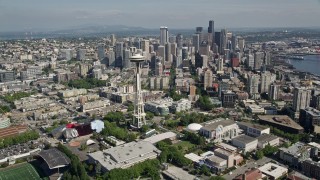 AX47_053E - 5K aerial stock footage fly over Seattle Center and by Space Needle to approach skyscrapers in Downtown Seattle, Washington