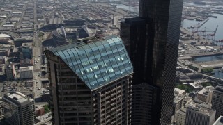 AX47_057 - 5K aerial stock footage orbit the roof of Seattle Municipal Tower in Downtown Seattle, Washington