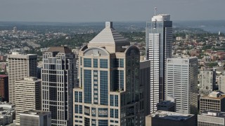 AX47_060 - 5K aerial stock footage of orbiting the top of 1201 Third Avenue Tower, Downtown Seattle, Washington