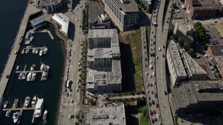 AX47_061 - 5K aerial stock footage of bird's eye of piers and apartment buildings on the Central Waterfront in Downtown Seattle, Washington