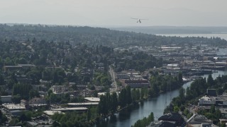 AX47_072 - 5K aerial stock footage of tracking a seaplane flying over Queen Anne, Seattle, Washington