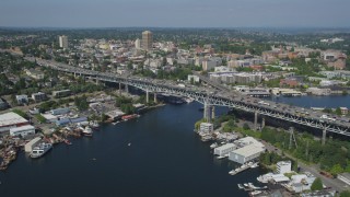 AX47_076 - 5K aerial stock footage approach the Ship Canal Bridge spanning the east side of Lake Union, Seattle, Washington