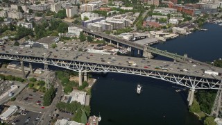 AX47_076E - 5K aerial stock footage of the Ship Canal Bridge spanning the east side of Lake Union, Seattle, Washington