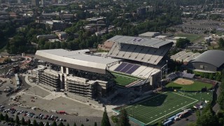 AX47_085E - 5K aerial stock footage orbit Husky Stadium, University of Washington, Seattle