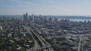 AX47_093 - 5K aerial stock footage fly over heavy traffic on Interstate 5 to approach Downtown Seattle skyline in Washington