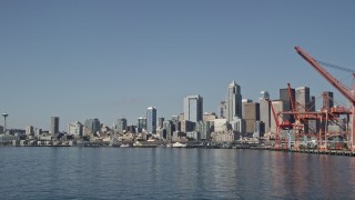 AX47_106 - 5K aerial stock footage fly low and approach the Downtown Seattle skyline and Central Waterfront, Washington