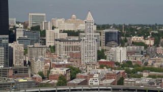 AX47_122 - 5K aerial stock footage flyby Smith Tower and city buildings in Downtown Seattle, Washington