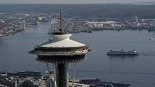 AX47_127E - 5K aerial stock footage of orbiting around the top of the Space Needle in Downtown Seattle, Washington