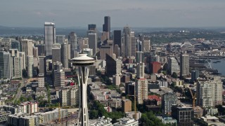 AX47_132 - 5K aerial stock footage pass by the iconic Seattle Space Needle with skyscrapers in the background, Downtown Seattle, Washington