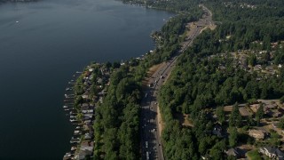 AX48_005E - 5K aerial stock footage approach I-405 and lakeside homes in Bellevue, Washington