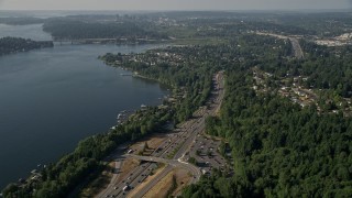 AX48_007 - 5K stock footage aerial video flyby I-405 through a lakeside residential area on the shore of Lake Washington, Bellevue, Washington