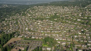 AX48_009E - 5K aerial stock footage of flying over rows of suburban tract homes in Bellevue, Washington