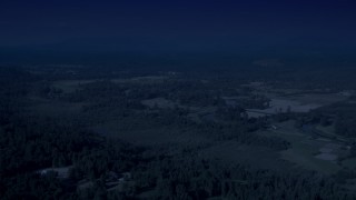 AX48_027_DFN - 4K day for night color corrected aerial stock footage of farmland in Carnation, Washington