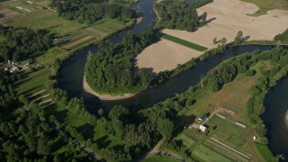 AX48_028 - 5K aerial stock footage tilt to a bird's eye view of the Snoqualmie River and farmland in Carnation, Washington