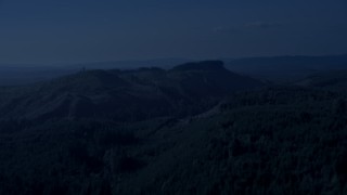 AX48_049_DFN - 4K day for night color corrected aerial stock footage of green hills and evergreen forest in King County, Washington