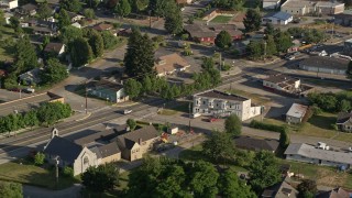 AX49_019 - 5K aerial stock footage of tracking a silver SUV on a road through a rural neighborhood, Carnation, Washington