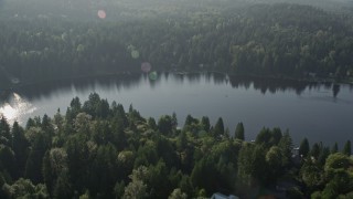 AX49_022 - 5K aerial stock footage of tree-lined Ames Lake and lakefront homes in King County, Washington