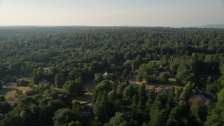 AX49_025 - 5K aerial stock footage of evergreen forests and rural neighborhoods, Sammamish, Washington