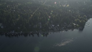 AX49_032 - 5K aerial stock footage fly over lakeside homes and docks, and suburban neighborhoods, in Bellevue, Washington