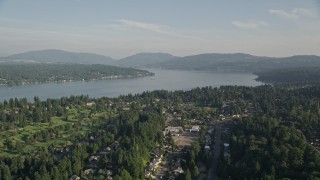 AX49_034 - 5K aerial stock footage of Lake Sammamish seen from suburban neighborhoods in Bellevue, Washington
