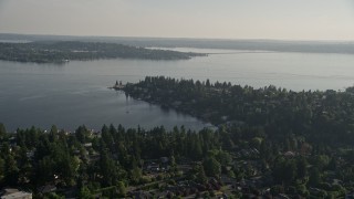 AX49_051E - 5K aerial stock footage fly over suburban neighborhoods toward waterfront homes on Lake Washington, Bellevue, Washington