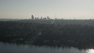 AX49_054 - 5K aerial stock footage of a view of the Downtown Seattle skyline from lakeside homes in Madrona, Washington