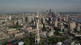 AX49_062E - 5K aerial stock footage of orbiting the Space Needle to reveal Downtown Seattle skyscrapers and high-rises, Washington