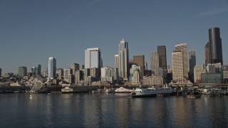 AX49_066 - 5K aerial stock footage of the Downtown Seattle skyline and the Central Waterfront seen from Elliott Bay, Washington