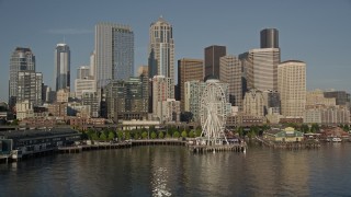 AX49_081 - 5K aerial stock footage of Seattle Aquarium and Great Wheel on the Central Waterfront, and skyline of Downtown Seattle, Washington