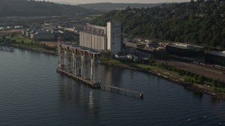 AX49_088 - 5K aerial stock footage flyby grain elevator on the shore of Elliott Bay in Seattle, Washington