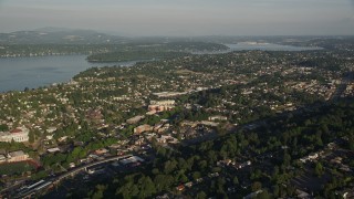 AX49_095 - 5K aerial stock footage of suburbs in Rainier Valley, Seattle, Washington, and approach Lake Washington