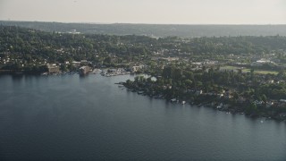 AX49_099 - 5K aerial stock footage of lakefront homes on the shore of Lake Washington by marina, Rainier Beach, Seattle, Washington