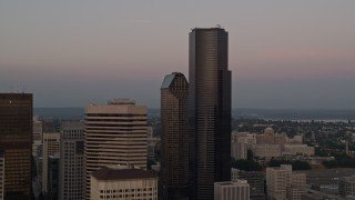 AX50_051 - 5K aerial stock footage of approaching the Columbia Center skyscraper in Downtown Seattle, Washington, sunset