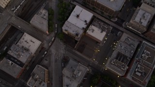 AX50_058 - 5K aerial stock footage of bird's eye view of city streets in Downtown Seattle, Washington at sunset