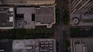 AX50_062 - 5K aerial stock footage of bird's eye view of 5th Avenue and city buildings in Downtown Seattle, Washington, sunset