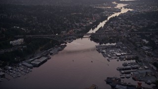 AX50_082E - 5K aerial stock footage of the Aurora Bridge spanning the Fremont Cut, Lake Union, Seattle, Washington, sunset