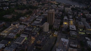 AX50_085 - 5K aerial stock footage orbit University District office buildings, and tilt to reveal the bridge and Lake Union, Seattle, Washington, twilight