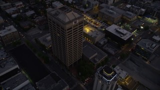 AX50_086 - 5K aerial stock footage fly over office buildings in the University District, Seattle, Washington, twilight