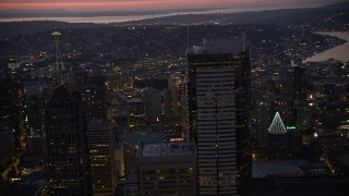 AX50_099 - 5K aerial stock footage orbit the Two Union Square skyscraper at twilight in Downtown Seattle, Washington