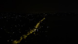 AX51_001 - 5K aerial stock footage of Rainier Avenue with light traffic, Lakeridge, Washington, night