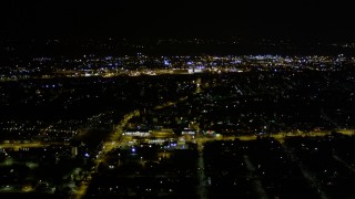 AX51_003E - 5K aerial stock footage flyby the lights of suburban neighborhoods, Rainier Beach, Seattle, Washington, night