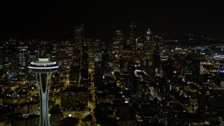 AX51_026 - 5K aerial stock footage of a view of Downtown Seattle skyscrapers, reveal the Space Needle, Washington, night