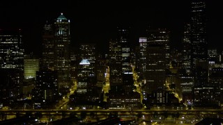 AX51_041 - 5K aerial stock footage of a view of Downtown Seattle skyscrapers at nighttime, Washington