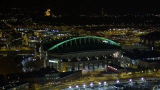 AX51_042 - 5K aerial stock footage of CenturyLink Field football stadium in Downtown Seattle, Washington, night