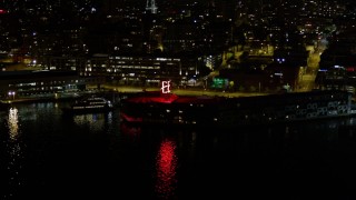 AX51_045 - 5K aerial stock footage of The Edgewater hotel at the Central Waterfront, Downtown Seattle, Washington, night