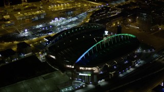 AX51_050 - 5K aerial stock footage approach the CenturyLink Field football stadium in Downtown Seattle, Washington, night