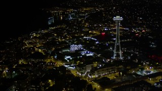 AX51_053E - 5K aerial stock footage approach and orbit Pacific Science Center and the Space Needle, Downtown Seattle, Washington, night