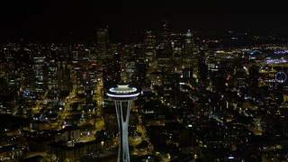 AX51_056 - 5K stock footage aerial video of Space Needle with Downtown Seattle skyscrapers in the background, Washington, night